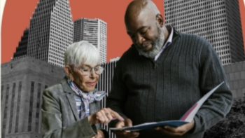 Two adults review a document together, pointing at the page, with a city skyline in the background.